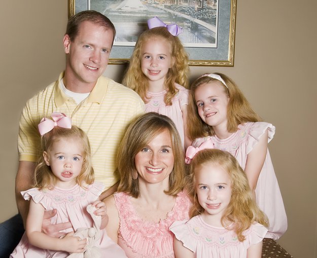 Tim and Meredith Simpson with their girls, Molly (2), Lily (8), and the twins, Allie (6), and Hailey (6).