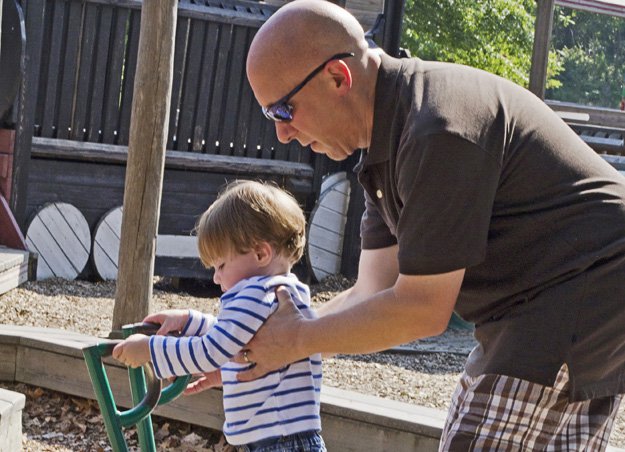 Eighteen-month-old Parker Swearingen is learning that dads and moms can be caregivers. Part of Michael's routine is taking Parker to the playground.