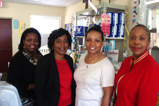 Helping teens are (l to r) Malisa Gillum, ex. dir. Hickory Hill Community Redevelopment Corp., Connie Booker, project manager, Lydia Walker, success coach, and Gwen Brown, director of the Teen Pregnancy and Parenting Program. Below, the baby store at...