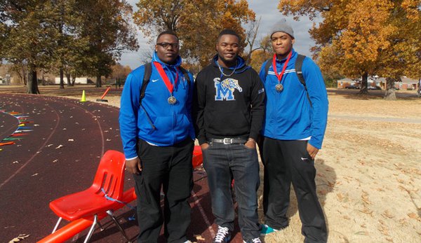 Karl Chambers, Jr. (middle) returned to East High students to support kids in the HKT marathon program.