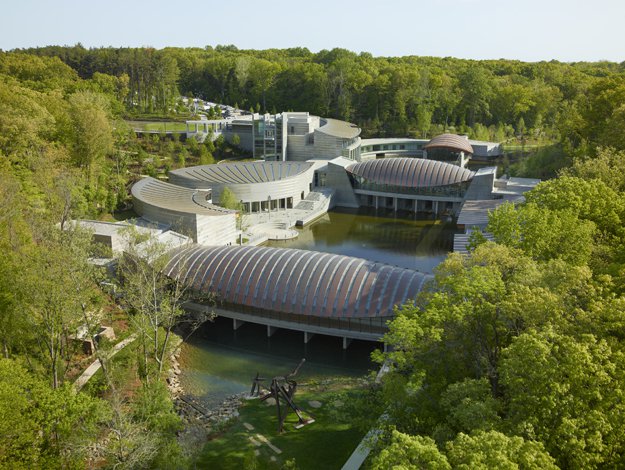 Aerial view of Crystal Bridges Museum of American Art, designed by Safdie Architects; photography by Timothy Hursley. Courtesy of Crystal Bridges Museum of American Art, Bentonville, Arkansas.